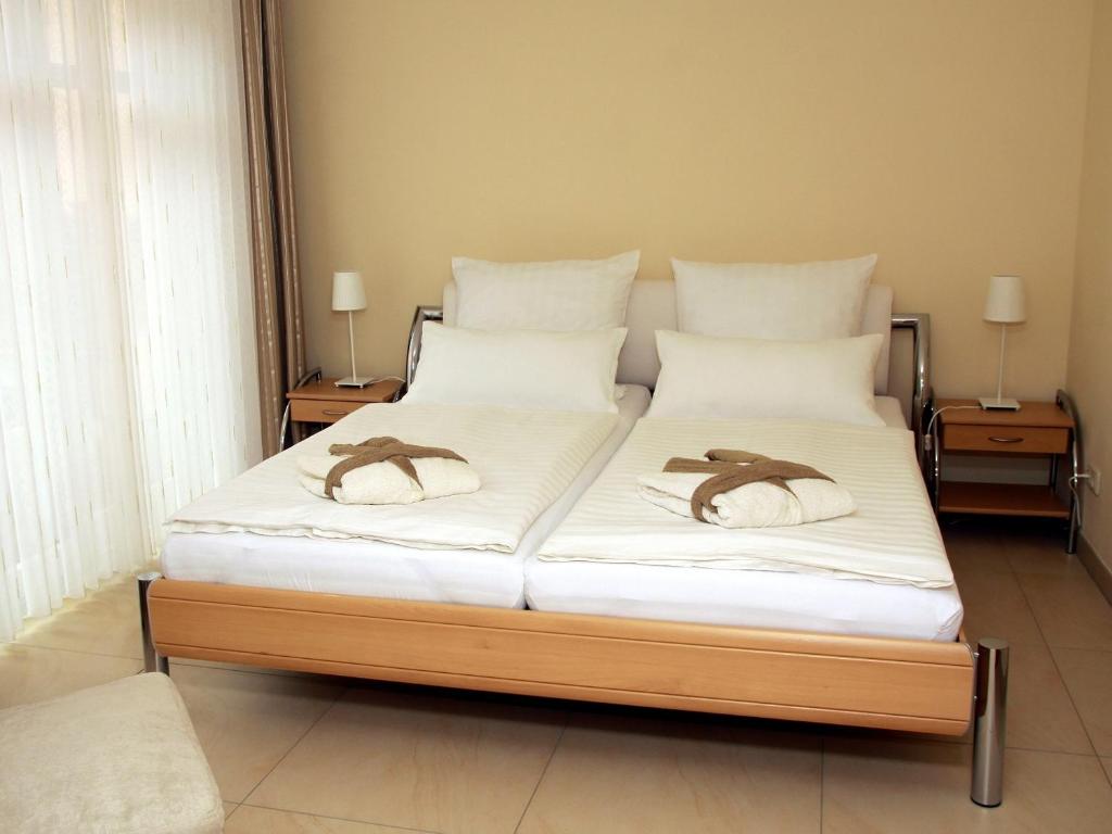 Postel nebo postele na pokoji v ubytování Bugenhagen - Classic Appartements