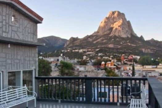 a view of a mountain from a balcony of a building at Hotel Don Porfirio in Bernal