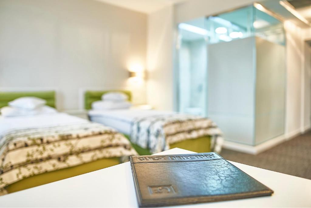 a book sitting on a table in a hotel room at Continental Forum Sibiu in Sibiu