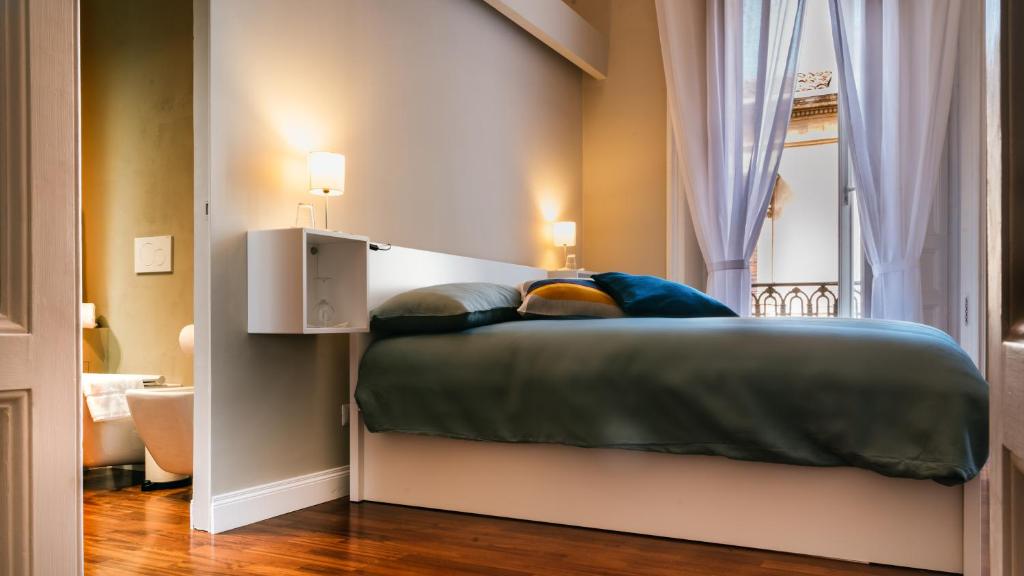 Postel nebo postele na pokoji v ubytování b&b le 4 leggende