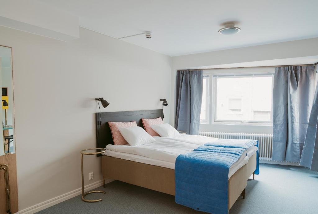 Posteľ alebo postele v izbe v ubytovaní 2Home Hotel Gävle