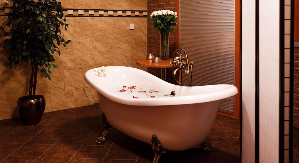 Koupelna v ubytování Olympia Wellness Hotel