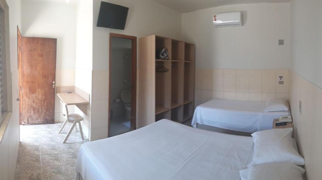Postel nebo postele na pokoji v ubytování Hotel Maringa