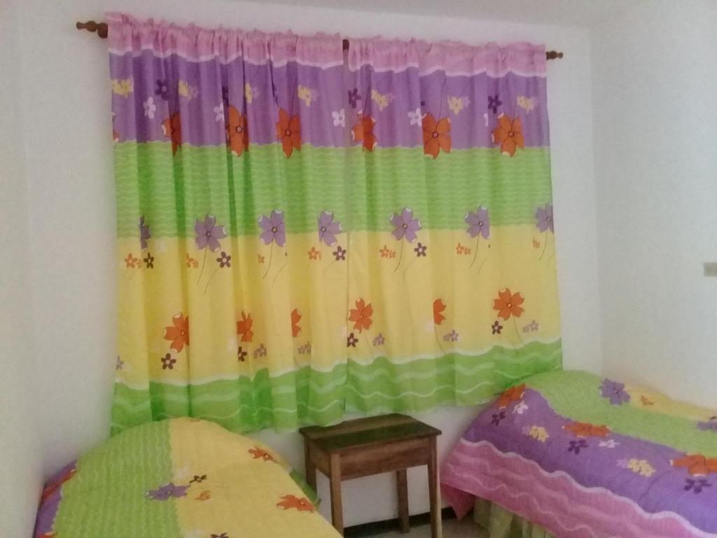 Postel nebo postele na pokoji v ubytování Hostel Quintonido