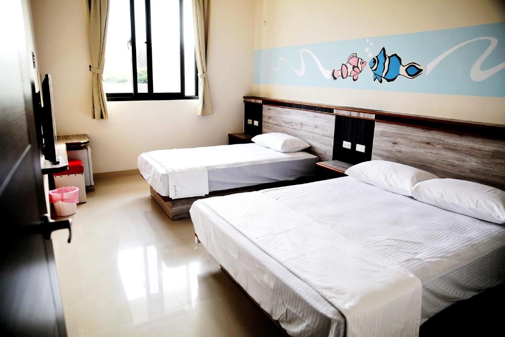 Postel nebo postele na pokoji v ubytování Caibei Homestay