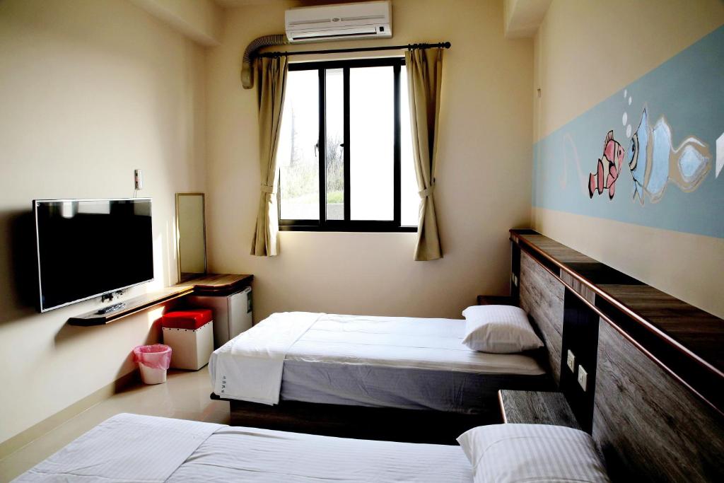 Postel nebo postele na pokoji v ubytování Caibei Homestay