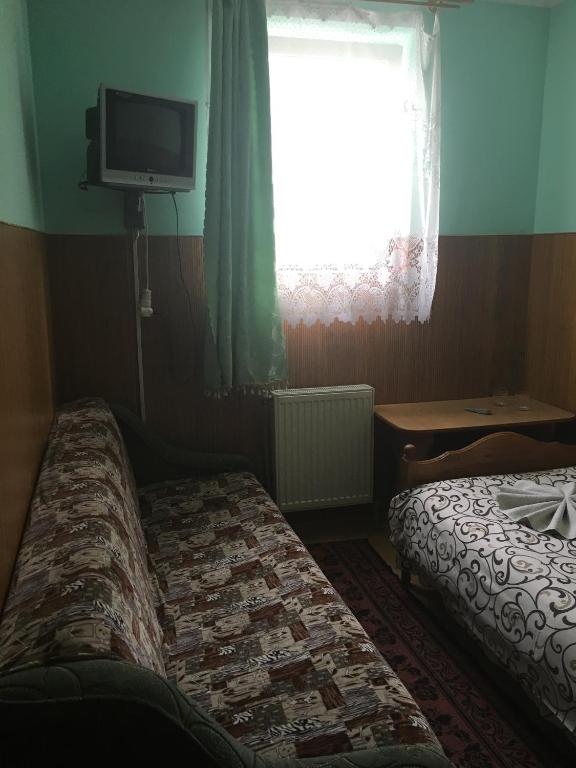 Postel nebo postele na pokoji v ubytování Садиба Достаток