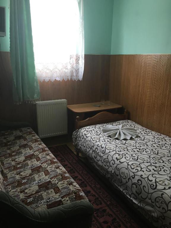 Postel nebo postele na pokoji v ubytování Садиба Достаток