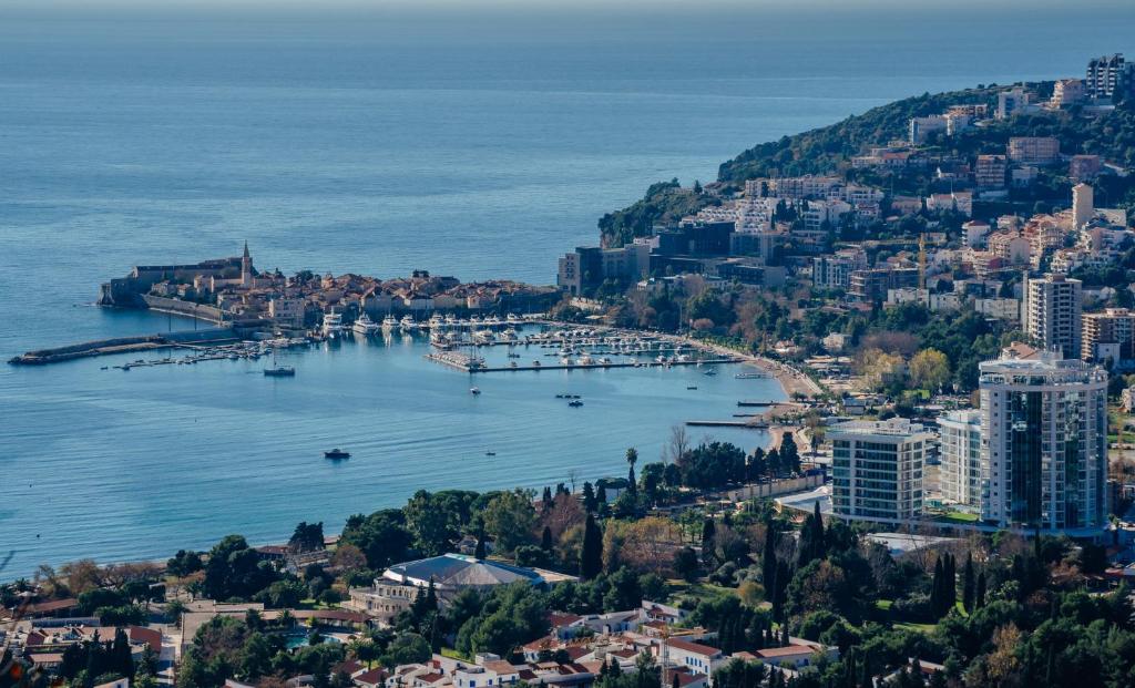 an aerial view of a city and a harbor at Hotel Tre Canne in Budva