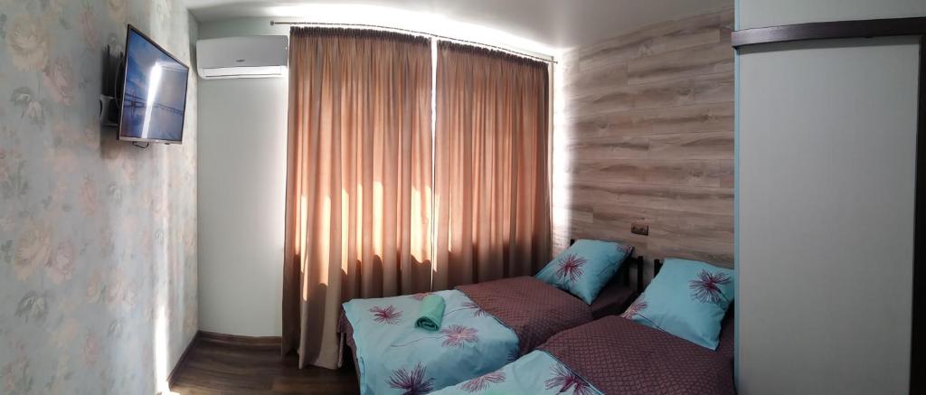TV a/nebo společenská místnost v ubytování Hostel Voyage