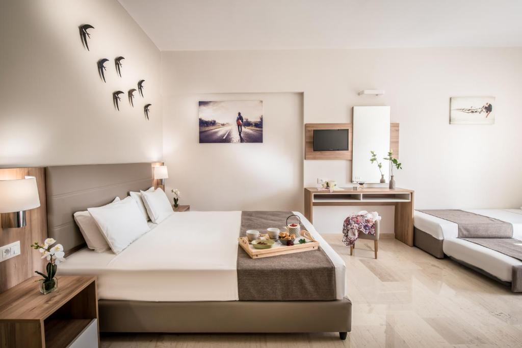 Postel nebo postele na pokoji v ubytování Marianthi Apts by Estia