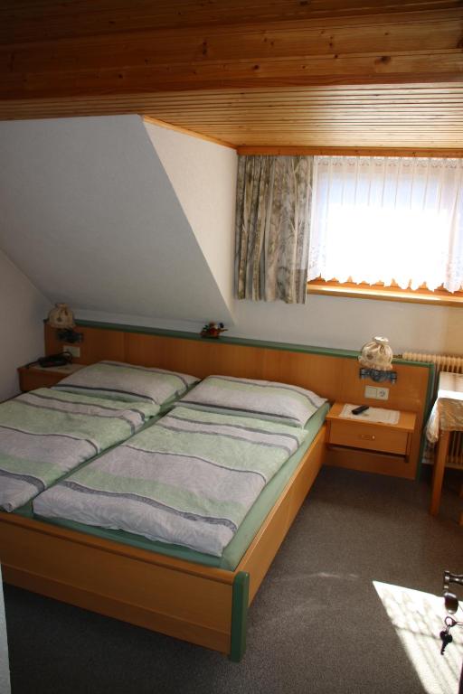 A bed or beds in a room at Haus Dorfer