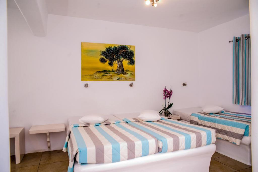 Кровать или кровати в номере Paradise Beach Resort