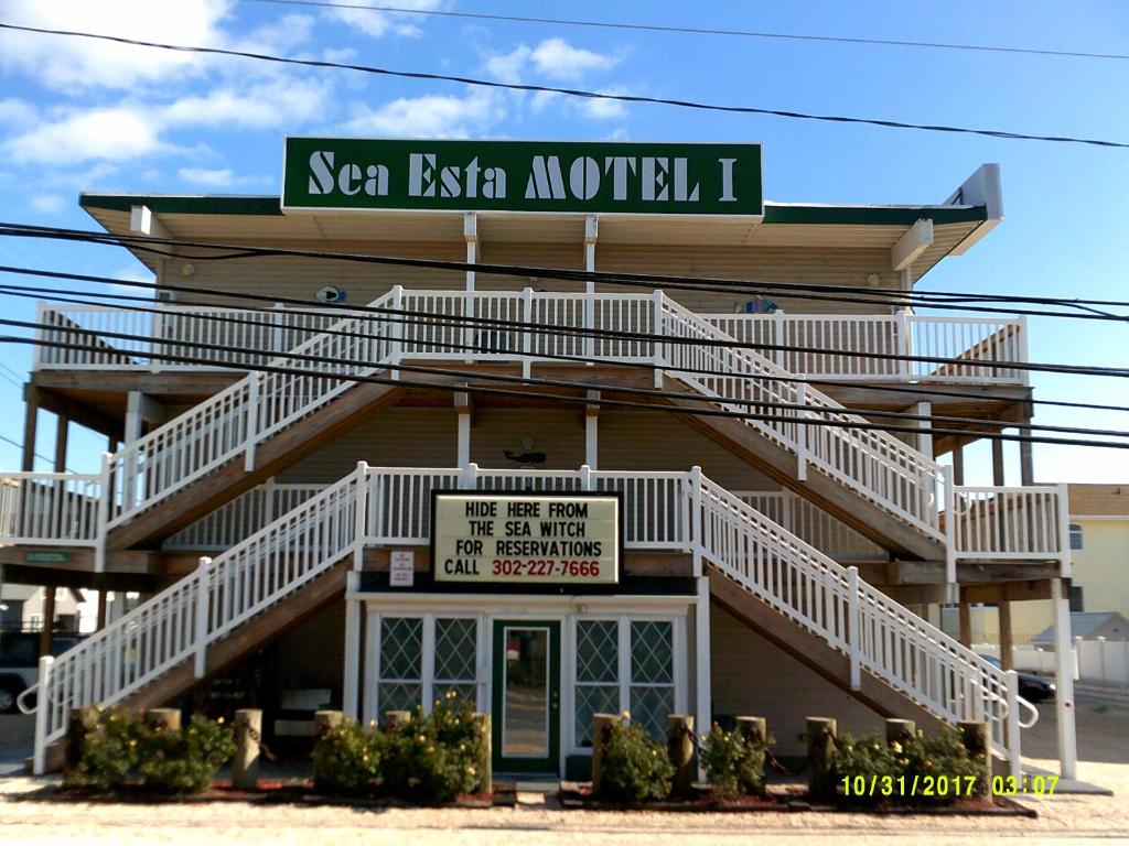 a building with a street sign on top of it at Sea Esta Motel 1 in Dewey Beach