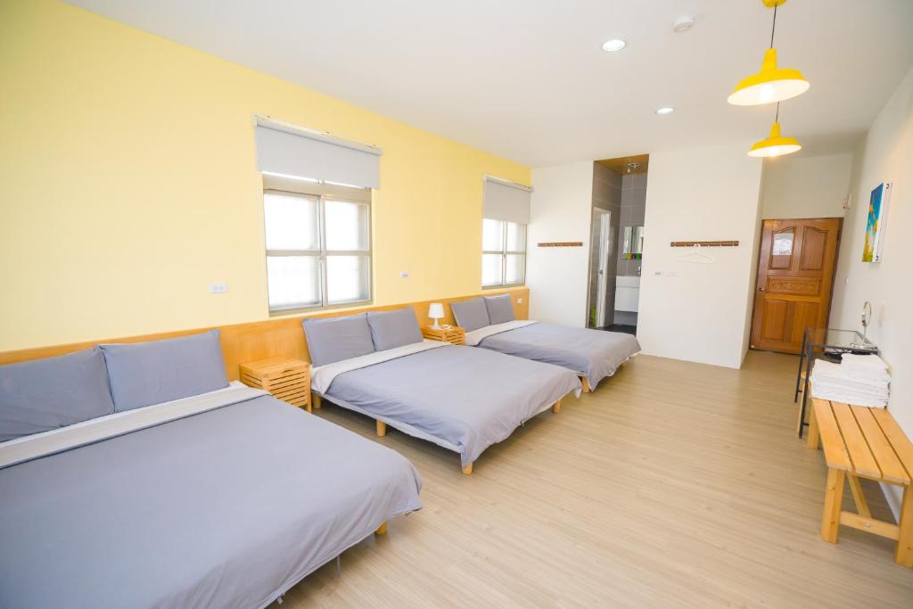 Postel nebo postele na pokoji v ubytování Colorful B&B
