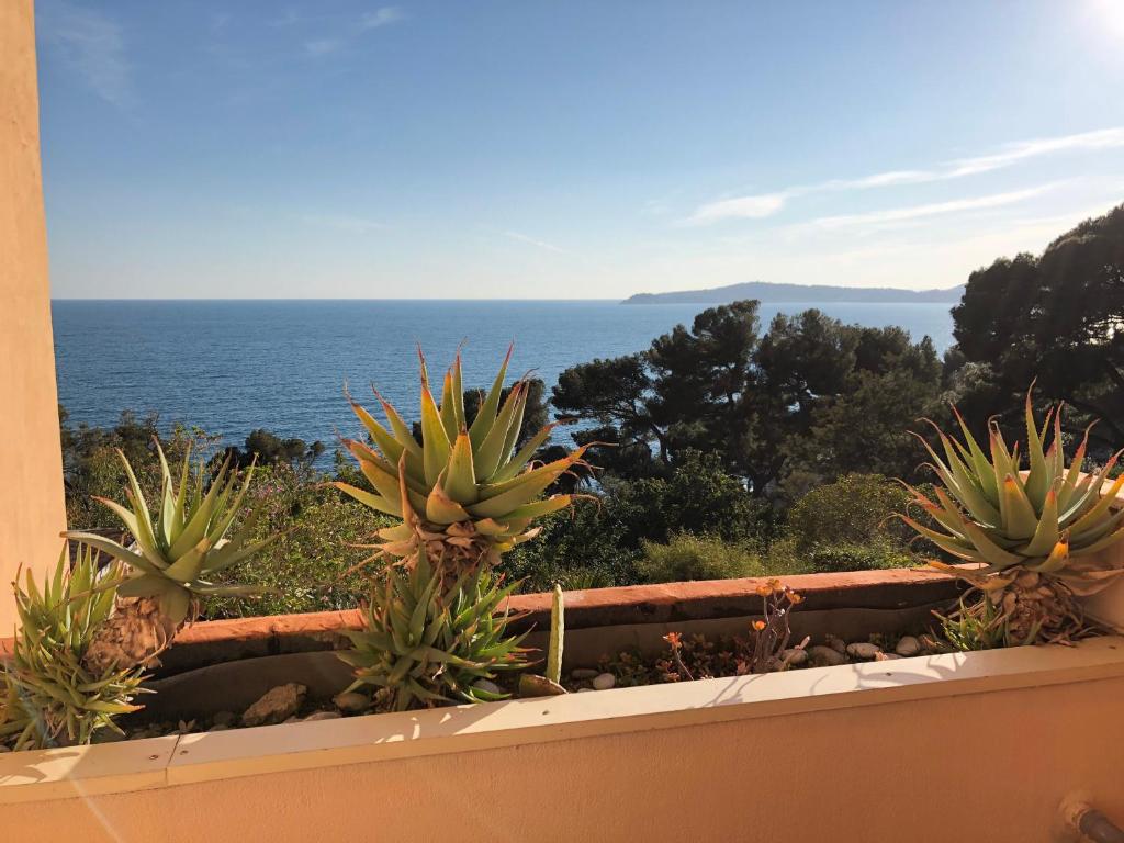 a view of the ocean from a balcony at Luxurious sea view apartment in Cap d'Ail