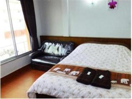 Postel nebo postele na pokoji v ubytování Orchid Inn
