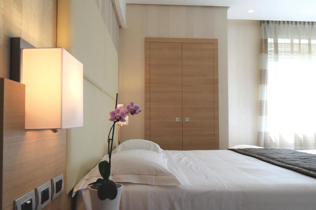 Postel nebo postele na pokoji v ubytování Hotel Continental