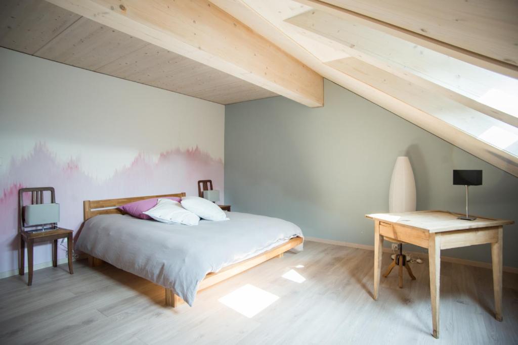 Postel nebo postele na pokoji v ubytování La Joux Chaupe