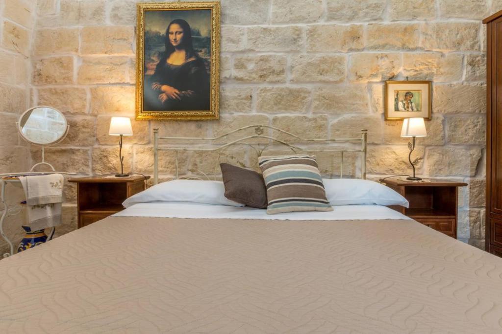 Postel nebo postele na pokoji v ubytování Corte Grika