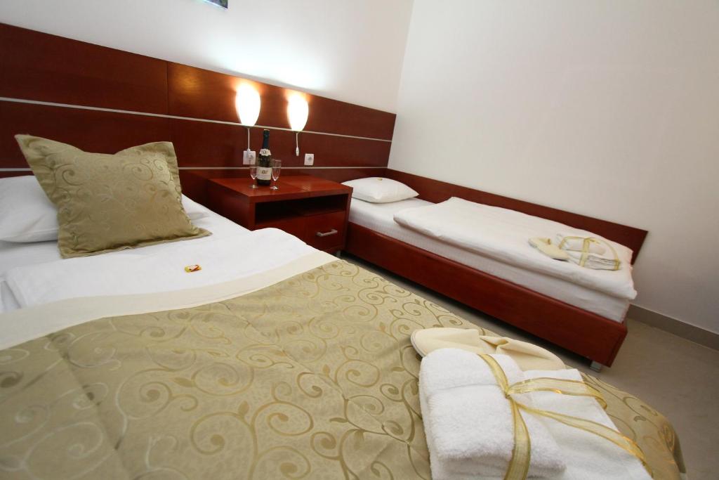 Postel nebo postele na pokoji v ubytování Guesthouse Villa Inn