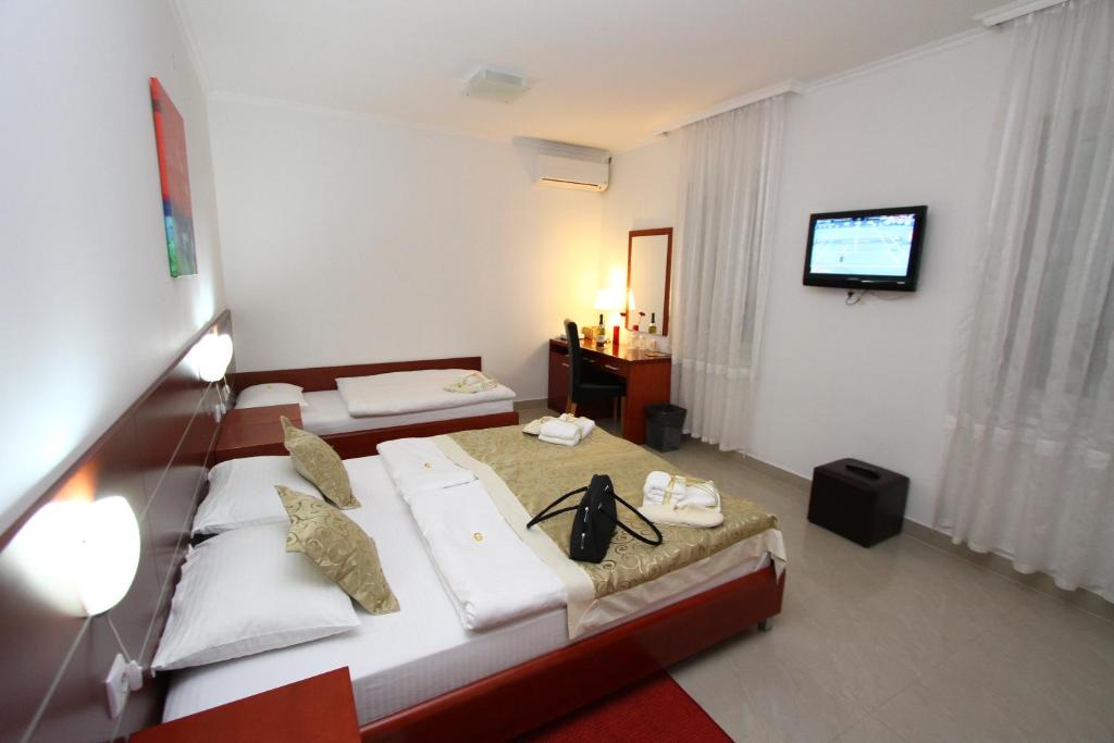 Postel nebo postele na pokoji v ubytování Guesthouse Villa Inn