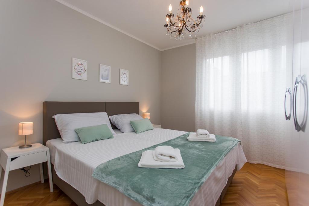 Posteľ alebo postele v izbe v ubytovaní Sweet Home Apatment Split