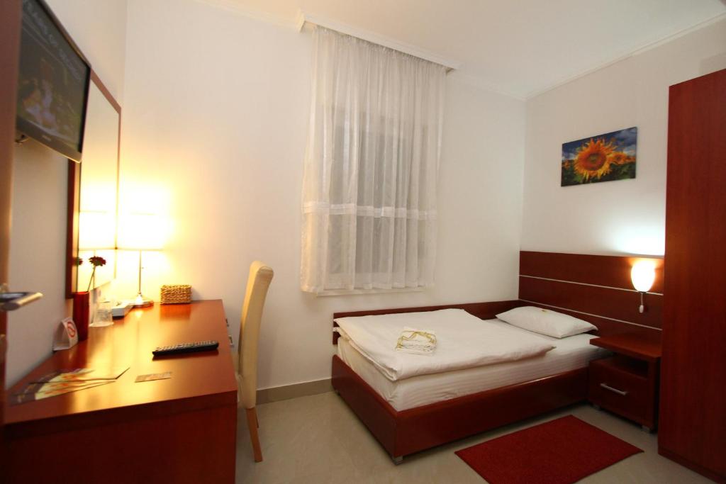 Postel nebo postele na pokoji v ubytování Guesthouse Villa Inn