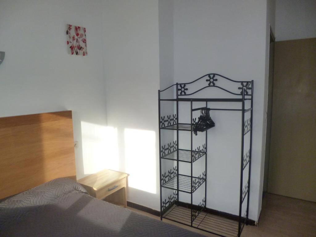 Postel nebo postele na pokoji v ubytování Hôtel le Calypso