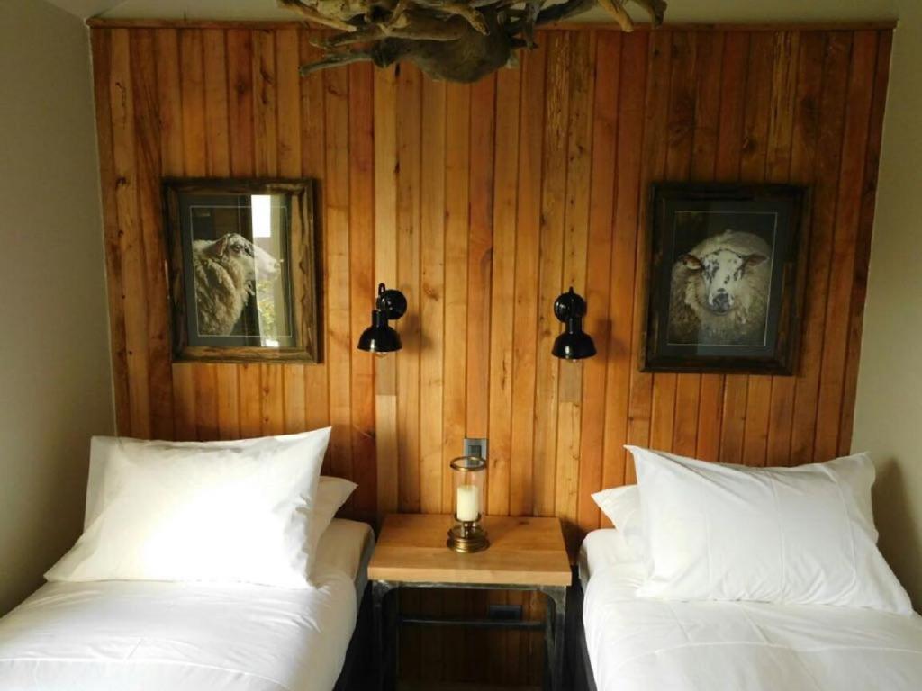 Postel nebo postele na pokoji v ubytování Hostal Boutique Factoria Patagonia