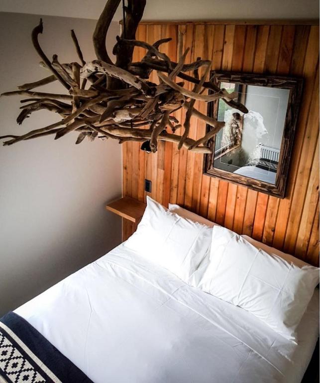 Postel nebo postele na pokoji v ubytování Hostal Boutique Factoria Patagonia