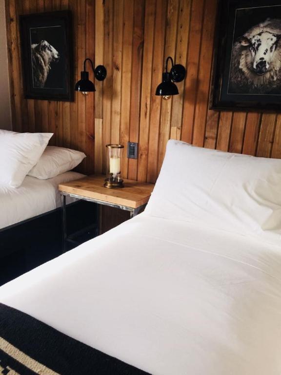 Postel nebo postele na pokoji v ubytování Hostal Boutique Factoria Patagonia