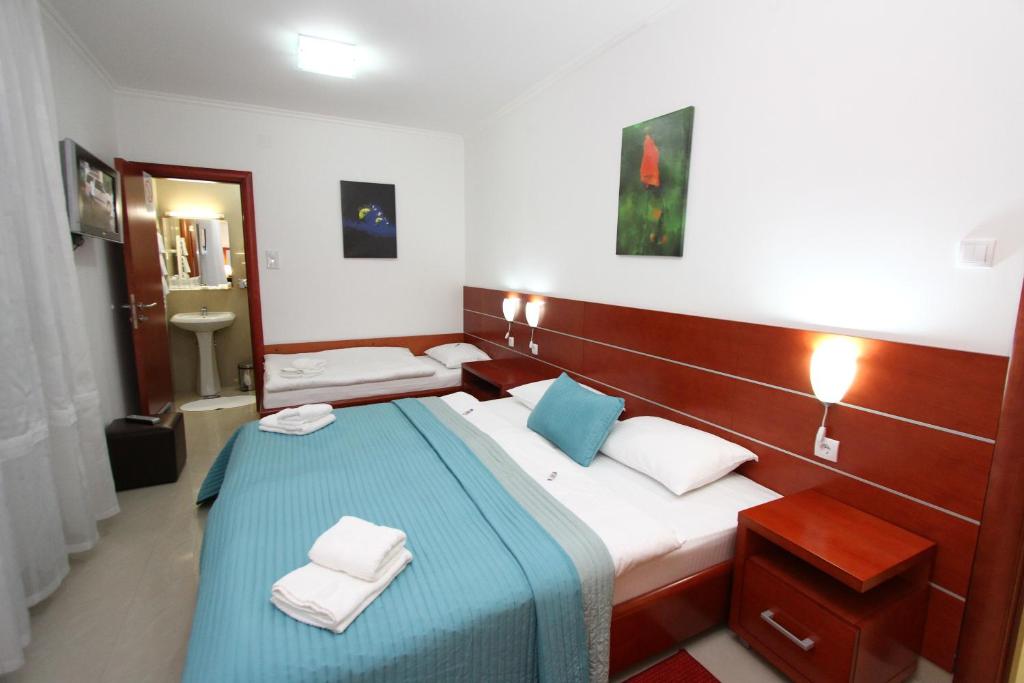 Postel nebo postele na pokoji v ubytování Guesthouse Villa Inn