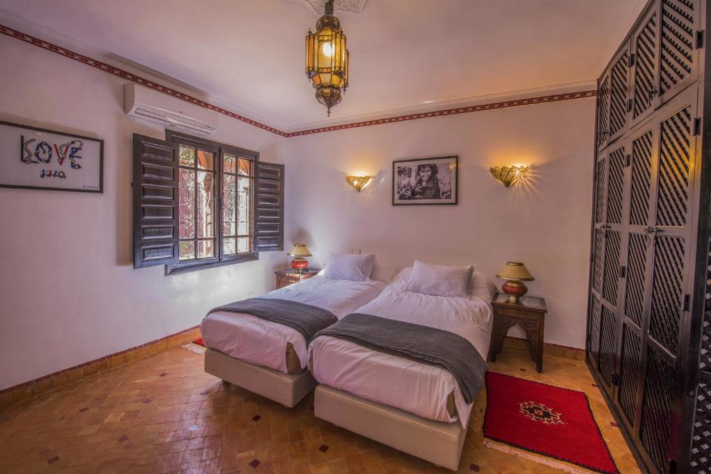 Postel nebo postele na pokoji v ubytování Maison Ayda