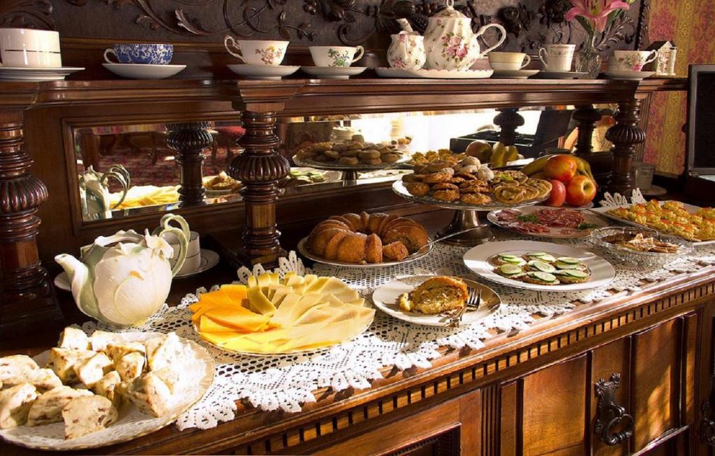 a buffet filled with many different types of food at Gingerbread Mansion in Ferndale