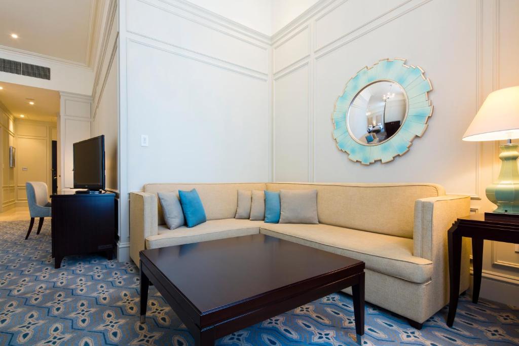 a living room with a couch and a table at The Tokyo Station Hotel in Tokyo
