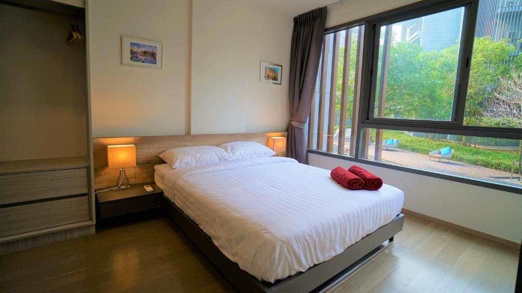 Postel nebo postele na pokoji v ubytování 23° Khao Yai