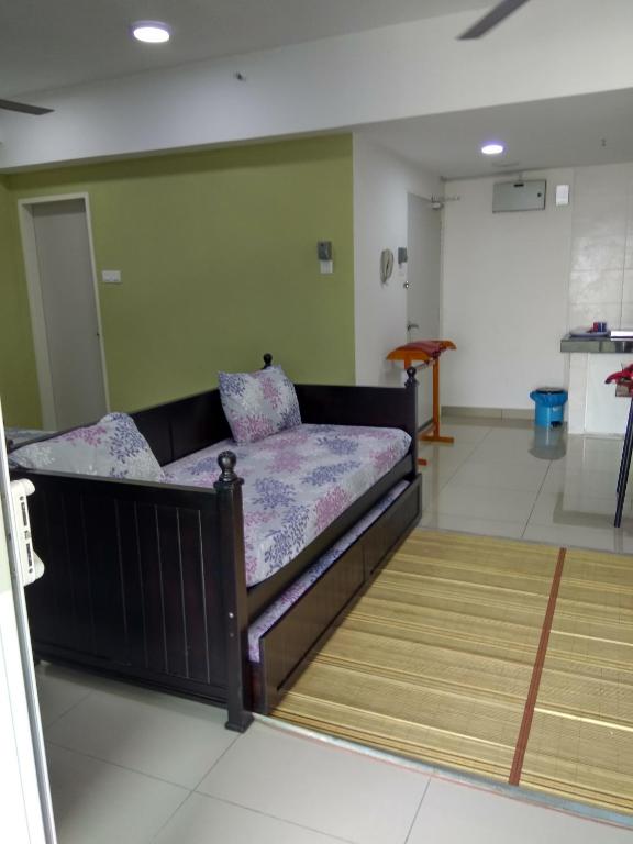 Postel nebo postele na pokoji v ubytování D'Perdana Apartment 2