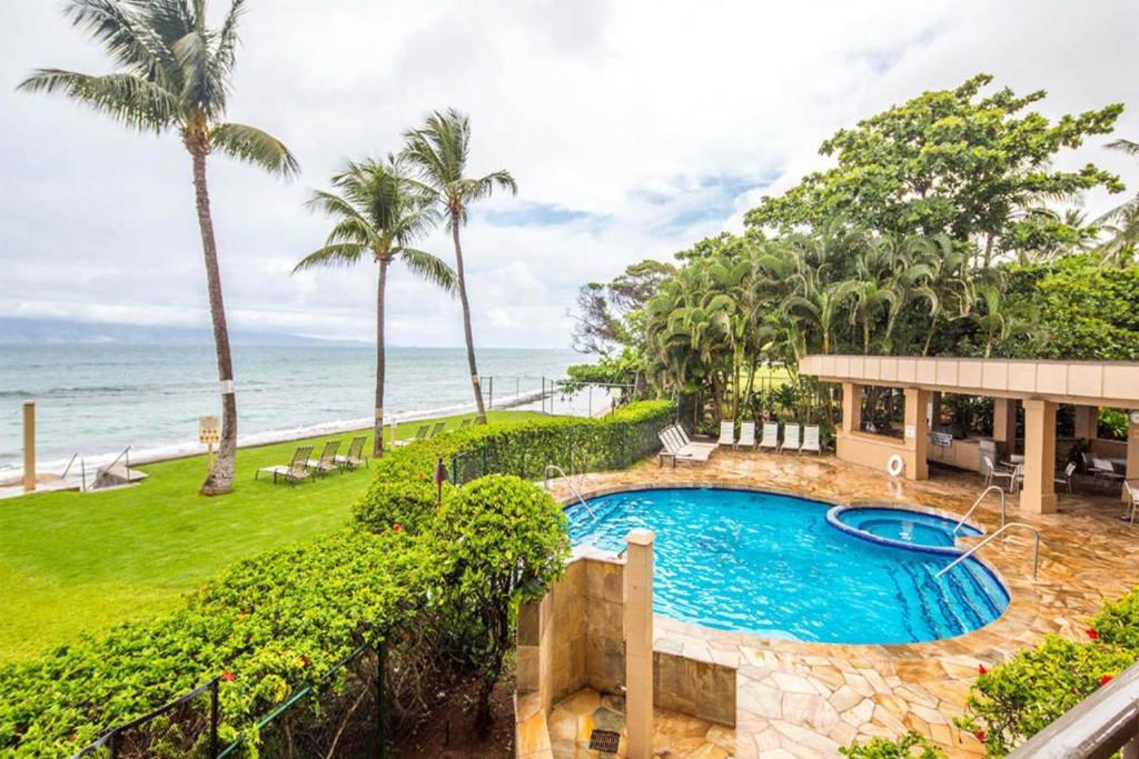 an overhead view of a swimming pool and the ocean at Paki Maui Condos in Honokowai