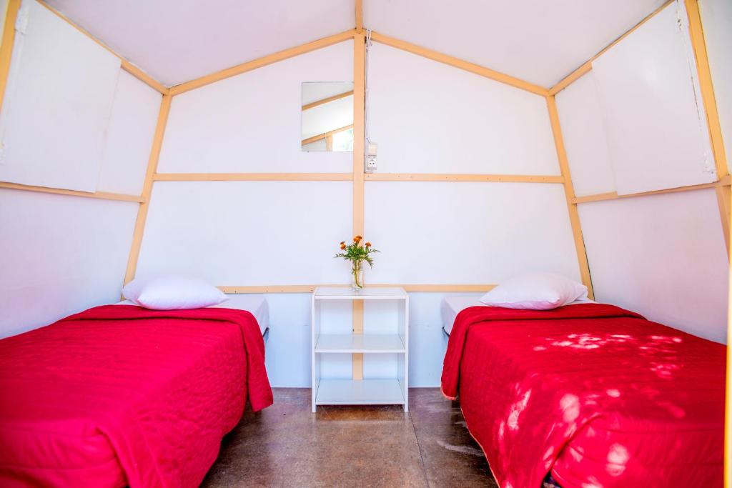 Postel nebo postele na pokoji v ubytování Paradise Beach Camping