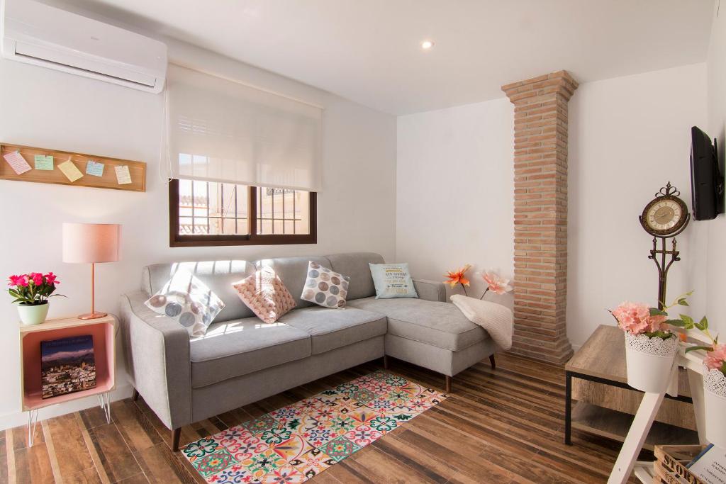 A seating area at terrazas de la catedral atico wifi