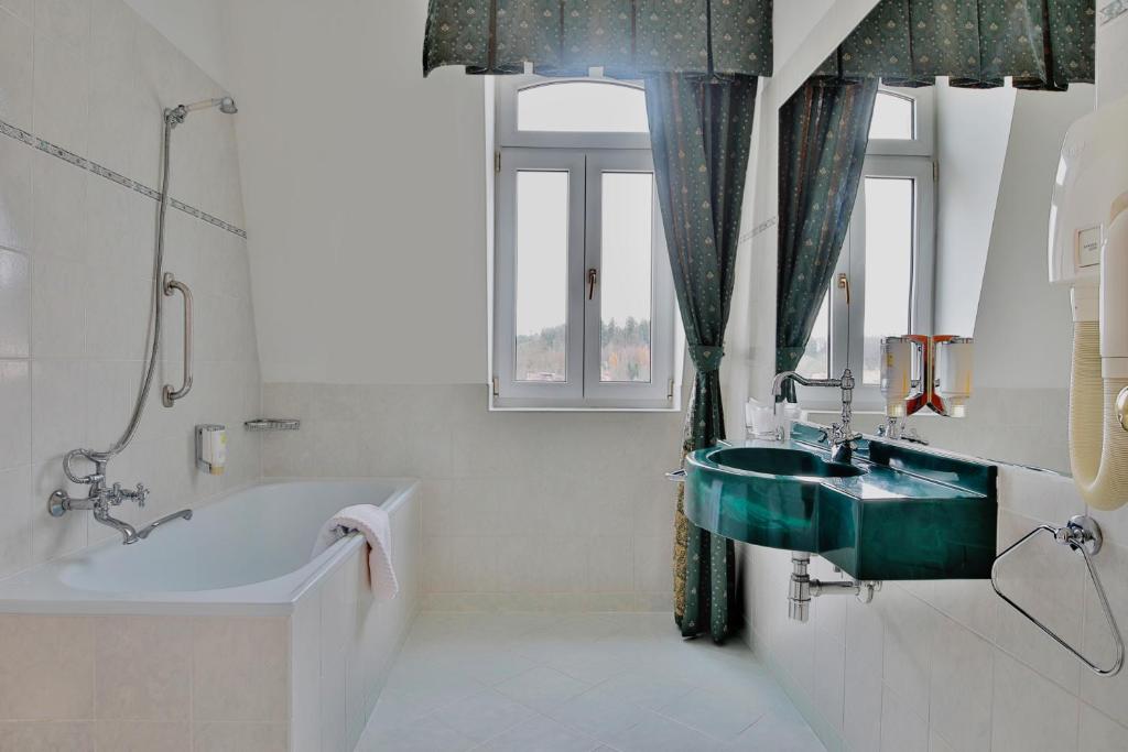 Kúpeľňa v ubytovaní Belvedere Wellness Hotel