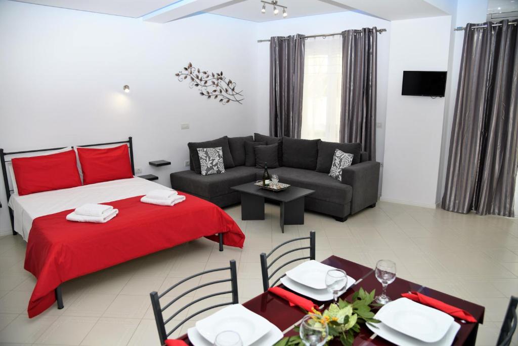 a living room with a bed and a couch at City Heart Luxury Studios in Rhodes Town