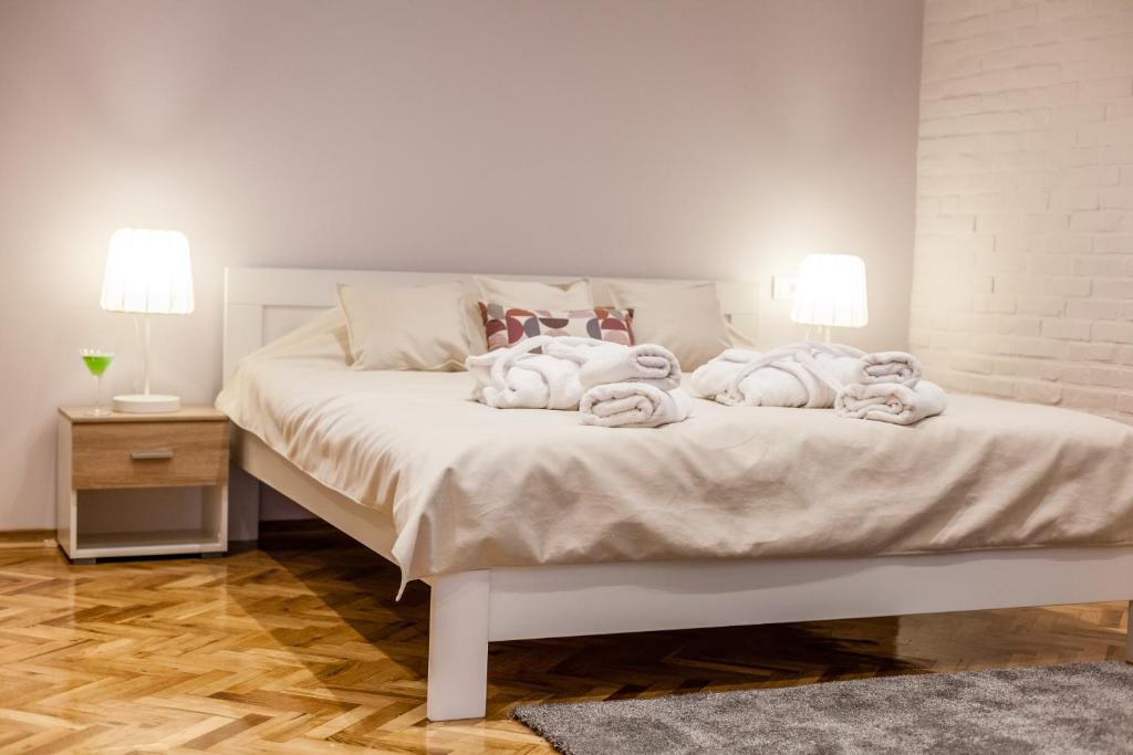 Postel nebo postele na pokoji v ubytování Apartmani studio