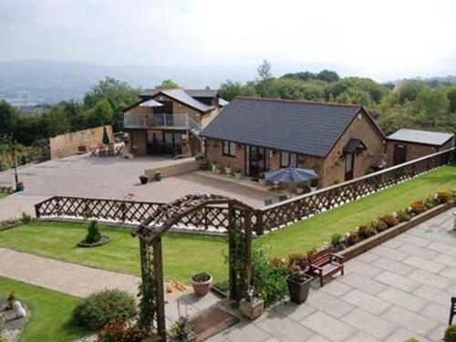 an aerial view of a house with a yard at Winchfawr Lodge in Merthyr Tydfil