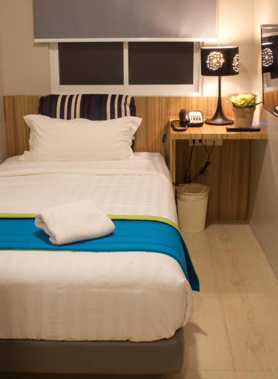Letto o letti in una camera di Z Pad Residences