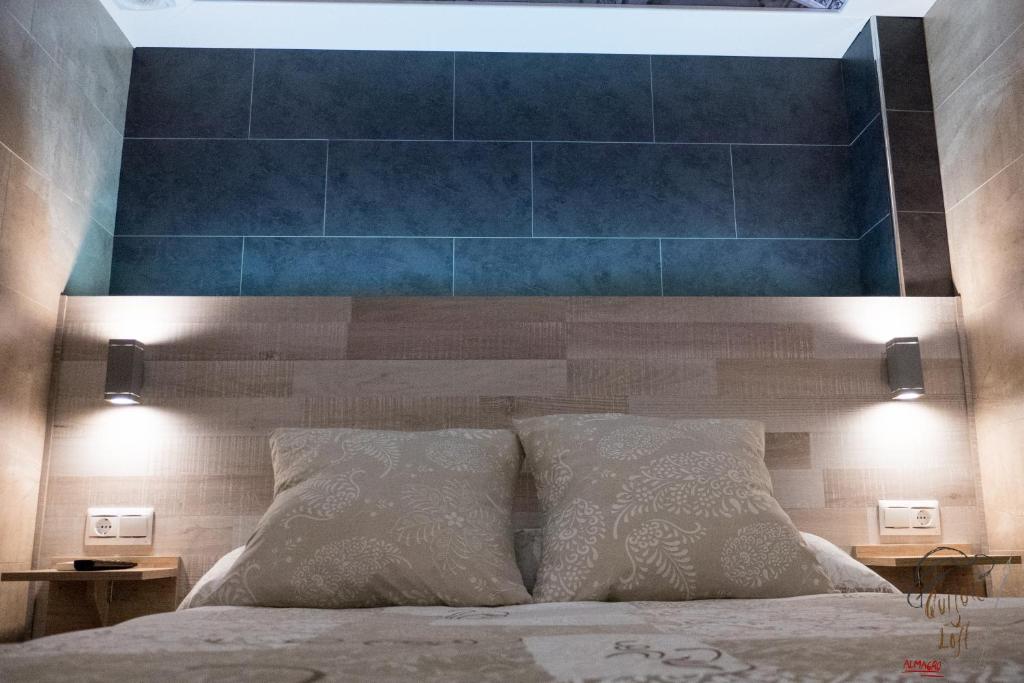 Postel nebo postele na pokoji v ubytování Apartamento Quixote Loft Almagro