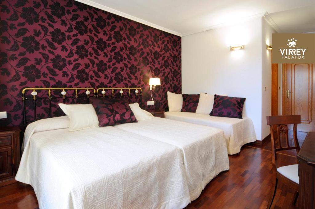 Postel nebo postele na pokoji v ubytování Hotel II Virrey