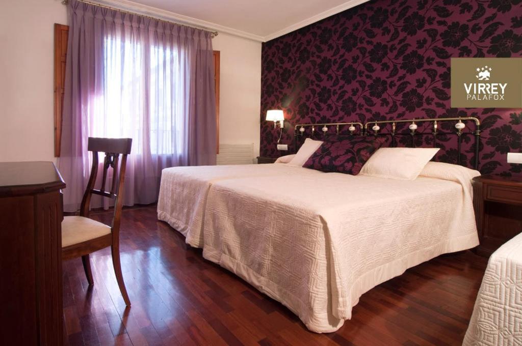 Postel nebo postele na pokoji v ubytování Hotel II Virrey