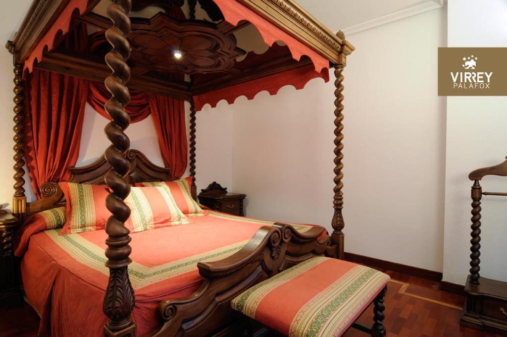 Postel nebo postele na pokoji v ubytování Hotel II Virrey